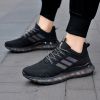 Popular men's breathable flying woven sneakers casual mesh shoes Popcorn sole running shoes 39-44